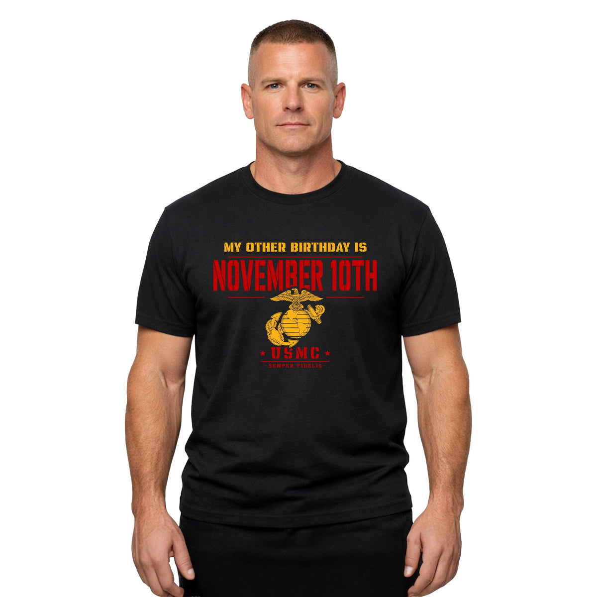 A man wearing a black short-sleeve t-shirt with a red and yellow graphic that reads 'MY OTHER BIRTHDAY IS NOVEMBER 10TH' and features a USMC emblem.